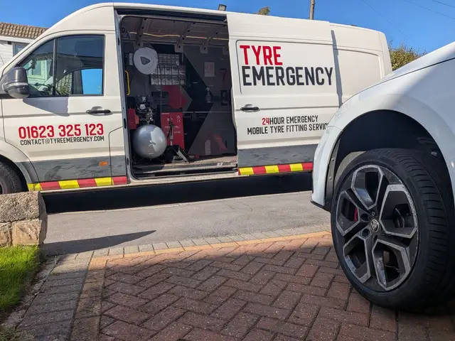 The Tyre Emergency van parked in the road beside a white Skoda on a block-paved drive in Rotherham, its new tyre fitted